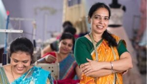 Women and Garment Industry- Indian women in textiles factory with arms crossed