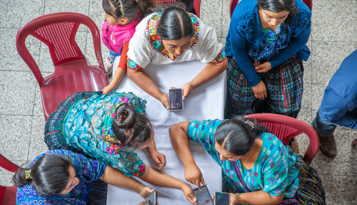 Farmers from around Cobán, Guatemala discuss weather information at a Mercy Corps workshop, as part of the Market Access for Small Producers programme. © Ezra Millstein/Mercy Corps