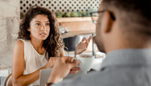 Woman and Man business meeting over coffee Business and Refugees