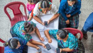 guatemala - women looking at mobile phones